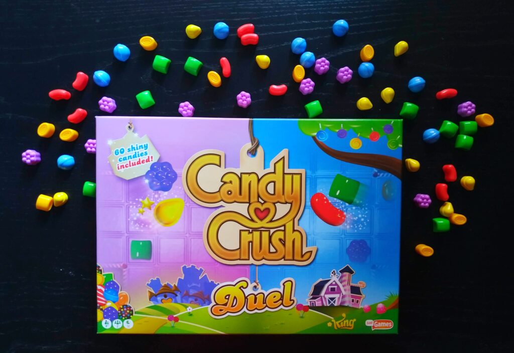 Cranio Creations Candy Crush Duel Pocket - Gioco Da Tavolo Tascabile Per 2 Giocatori - Edizione Rosa - Sfida A Colpi Di Caramelle Colorate